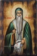 Ръчно рисувана икона на Свети Иван Рилски върху масивна дървена основа със състарен ефект.